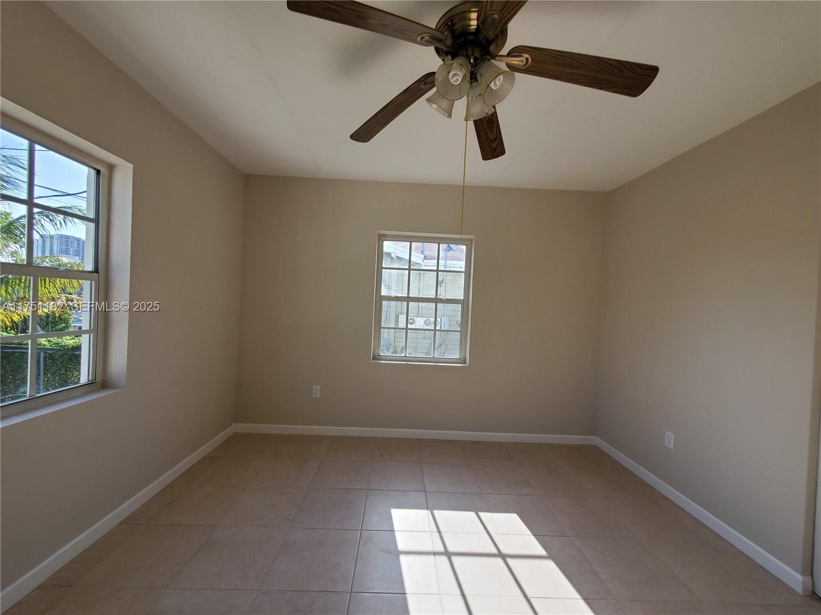 70 Northwest 33rd Street Miami, FL 33127 - Photo 23 of 48 an empty room with windows and fan
