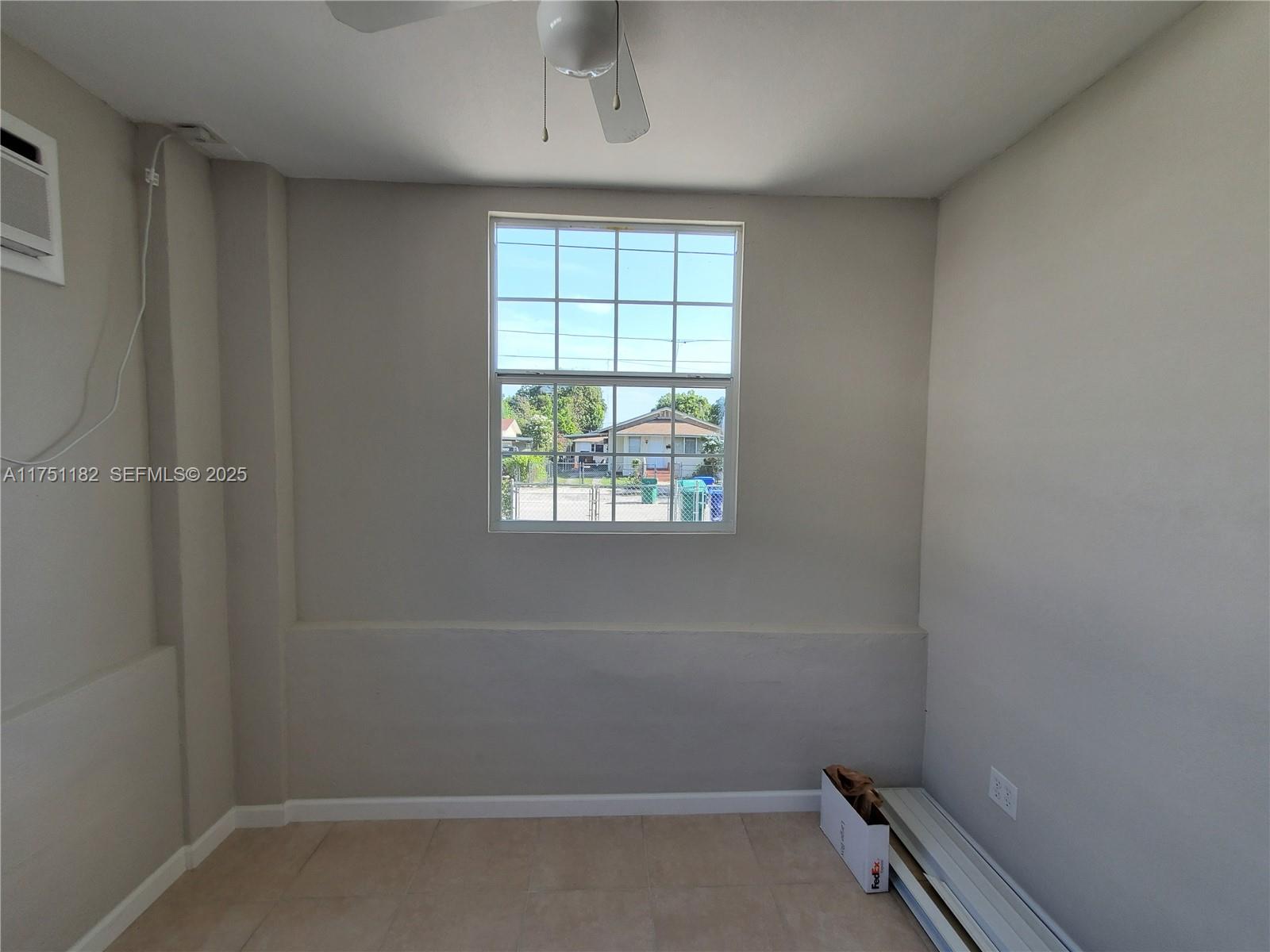 70 Northwest 33rd Street Miami, FL 33127 - Photo 29 of 48 an empty room with a window