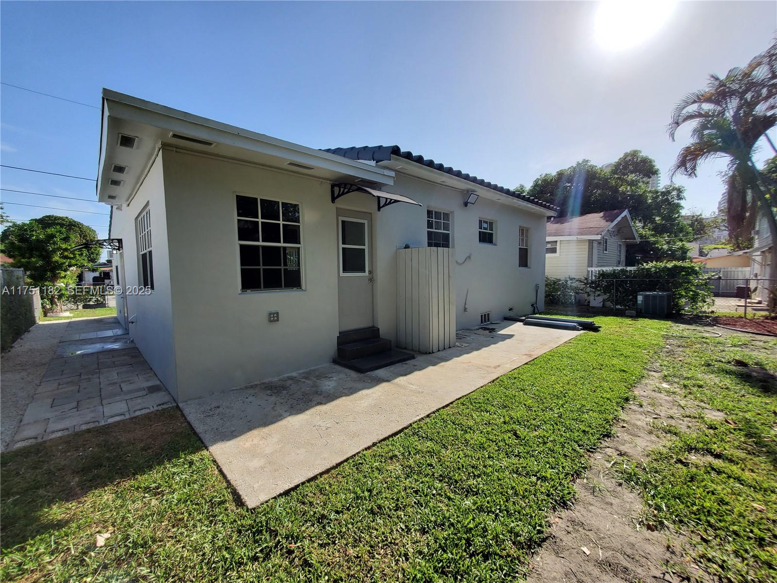 70 Northwest 33rd Street Miami, FL 33127 - Photo 45 of 48 a front view of a house with a yard