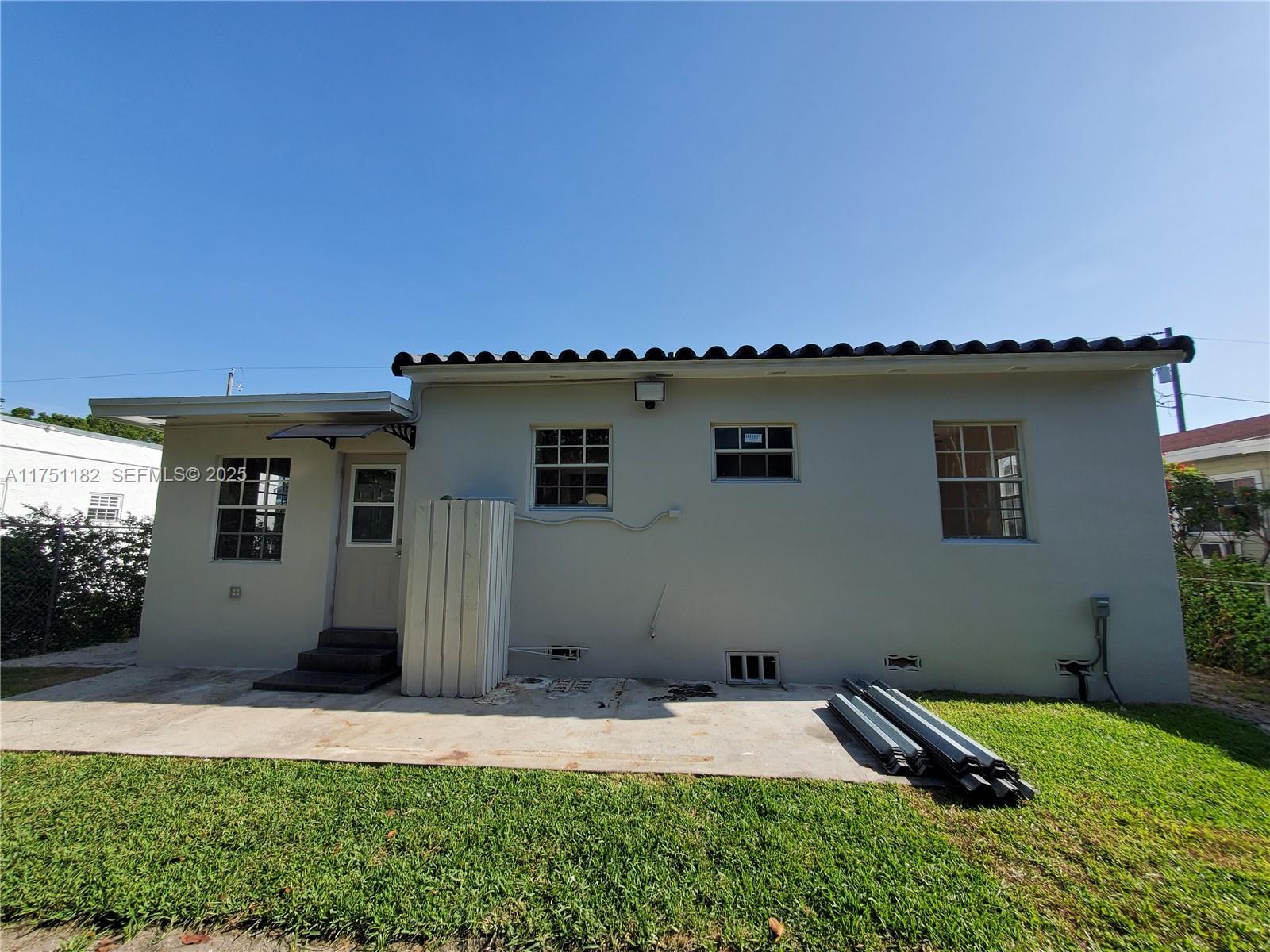 70 Northwest 33rd Street Miami, FL 33127 - Photo 46 of 48 a house view with a garden space