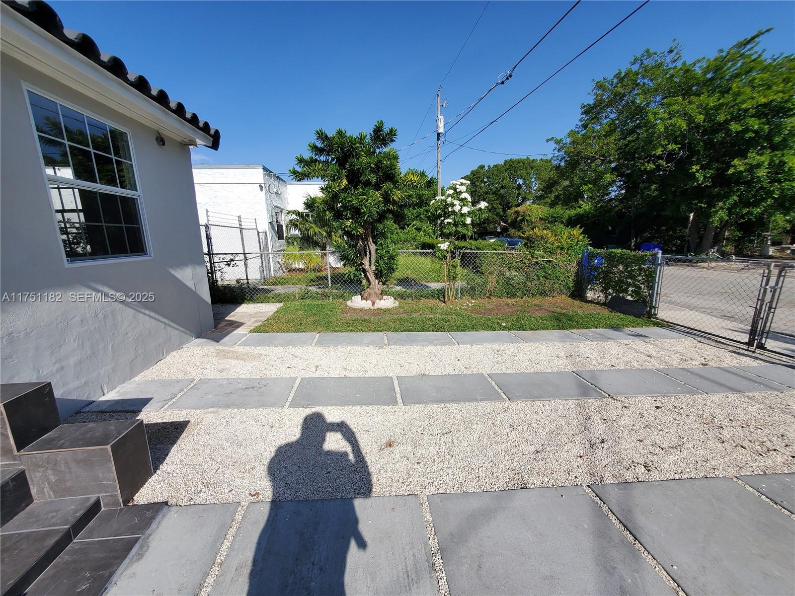 70 Northwest 33rd Street Miami, FL 33127 - Photo 6 of 48 a view of a yard and front view of a house