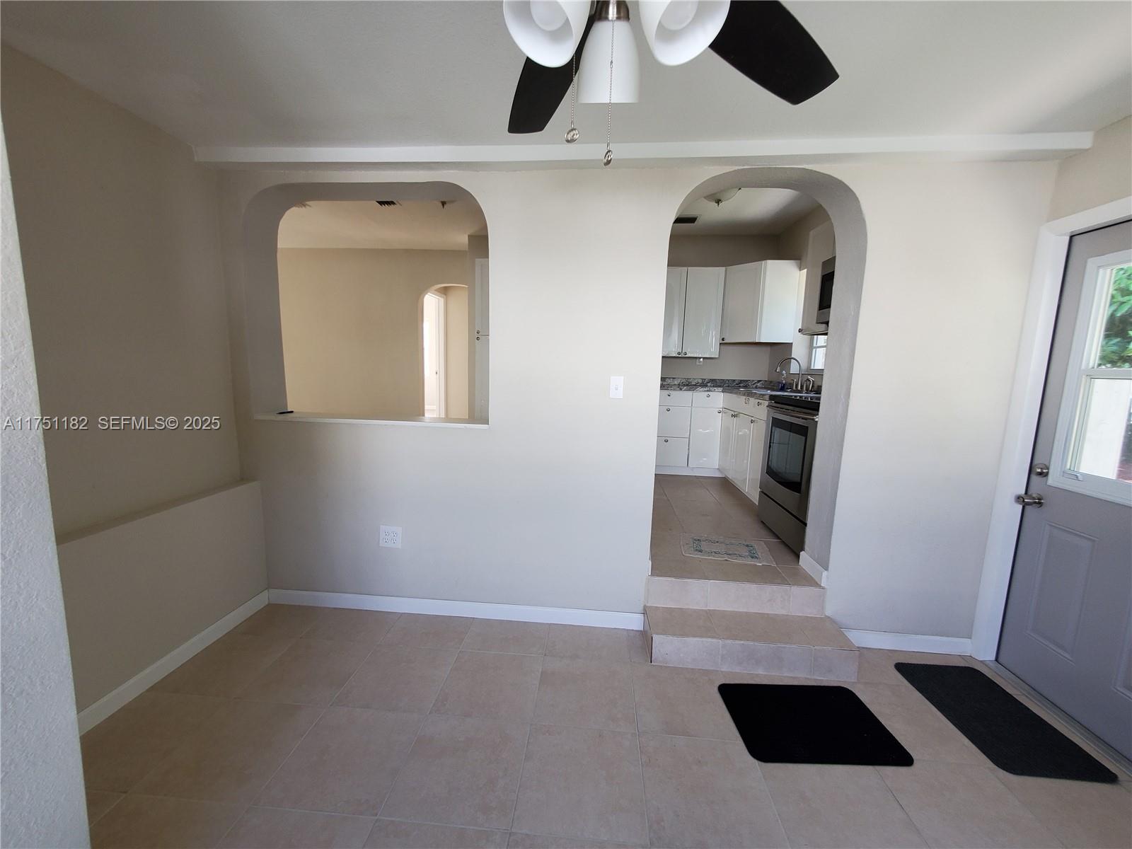 70 Northwest 33rd Street Miami, FL 33127 - Photo 10 of 48 a view of entryway and kitchen with a sink
