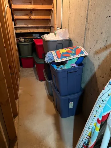 a view of an empty room with a fireplace and a projector