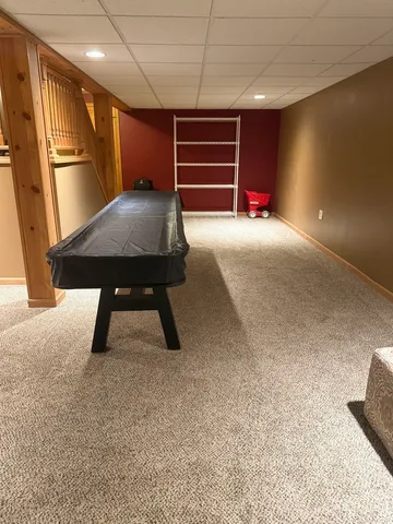 a view of a livingroom with furniture and chandelier