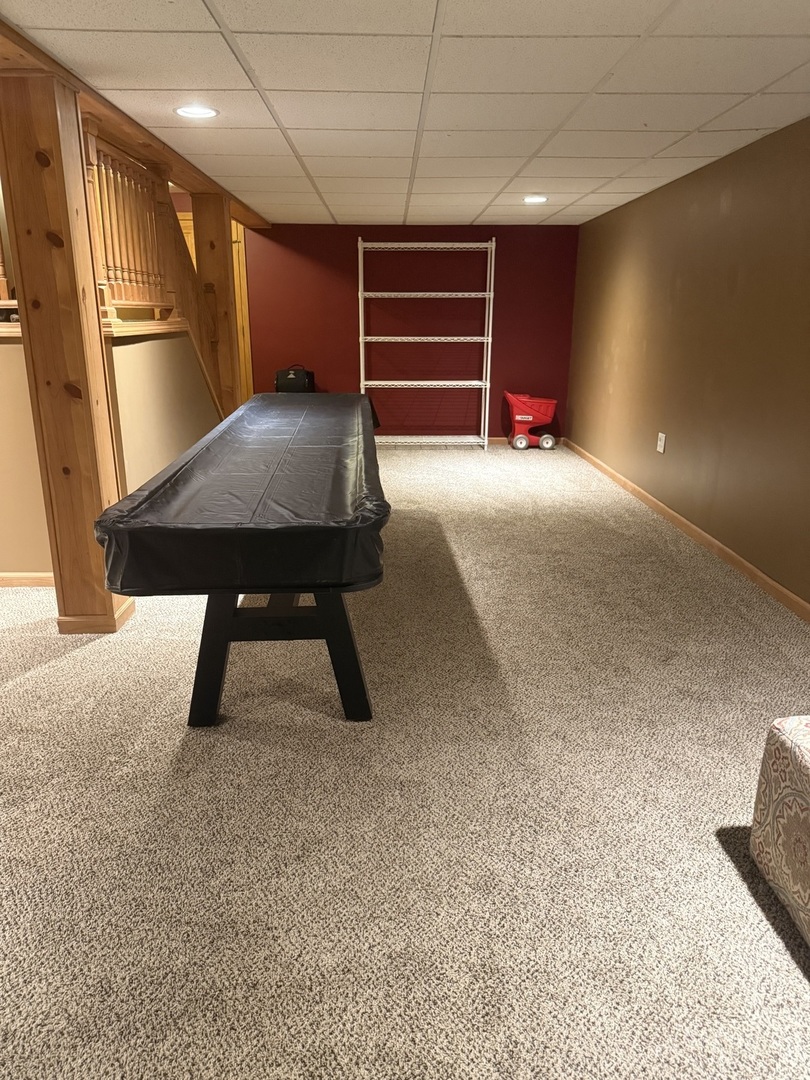 142 Sedgewicke Drive Romeoville, IL 60446 - Photo 15 of 18 a view of an empty room with a fireplace and a projector