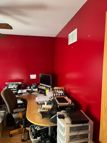 a view of a workspace with furniture