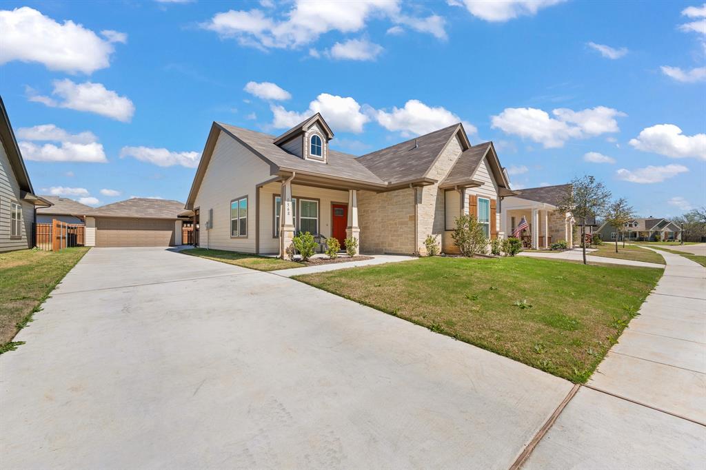 1568 Reverie Road Burleson, TX 76028 - Photo 2 of 26 a front view of a house with a yard