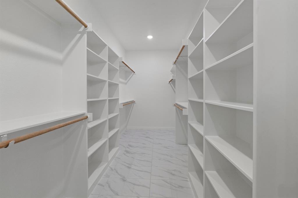 1568 Reverie Road Burleson, TX 76028 - Photo 21 of 26 a view of an empty walk in closet