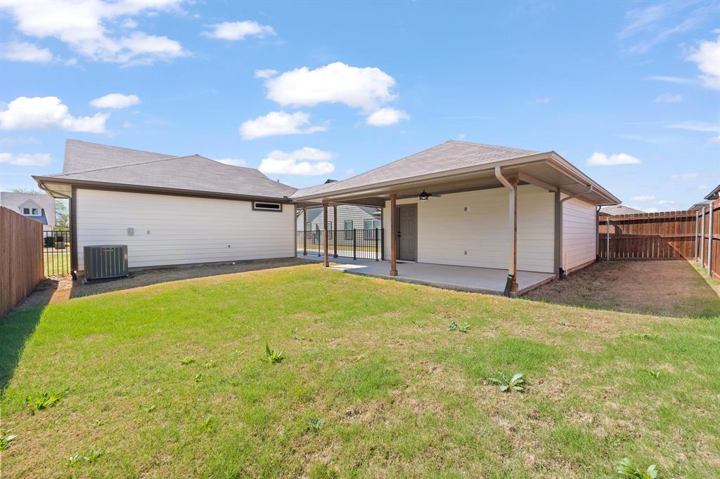 1568 Reverie Road Burleson, TX 76028 - Photo 25 of 26 a house view with a backyard space