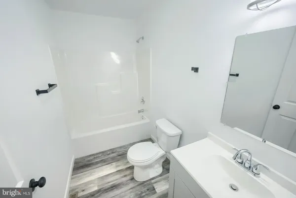 a view of a hallway with washer and dryer