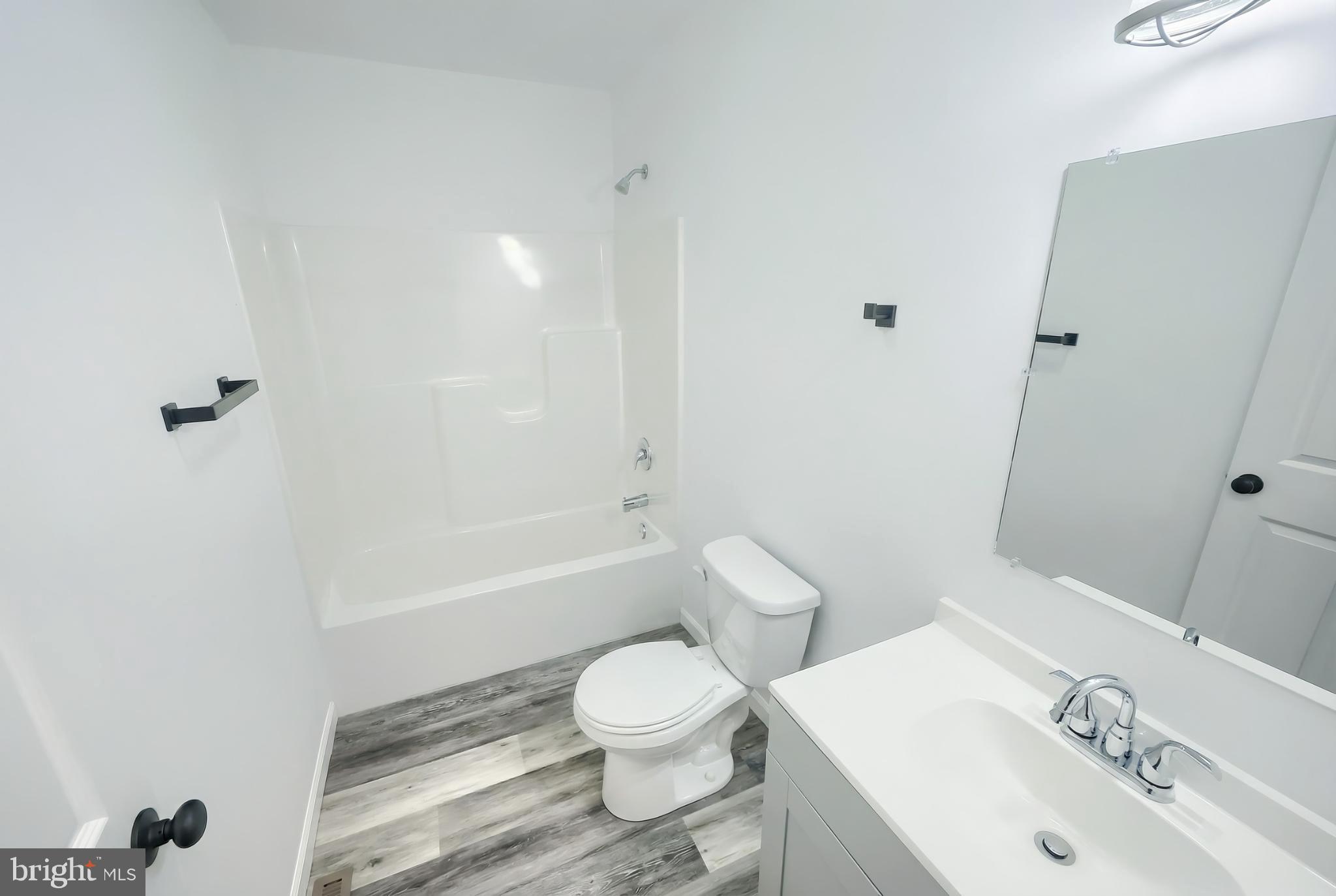 1885 Stoverstown Road, Unit 9 Spring Grove, PA 17362 - Photo 14 of 29 a bathroom with a sink toilet and shower