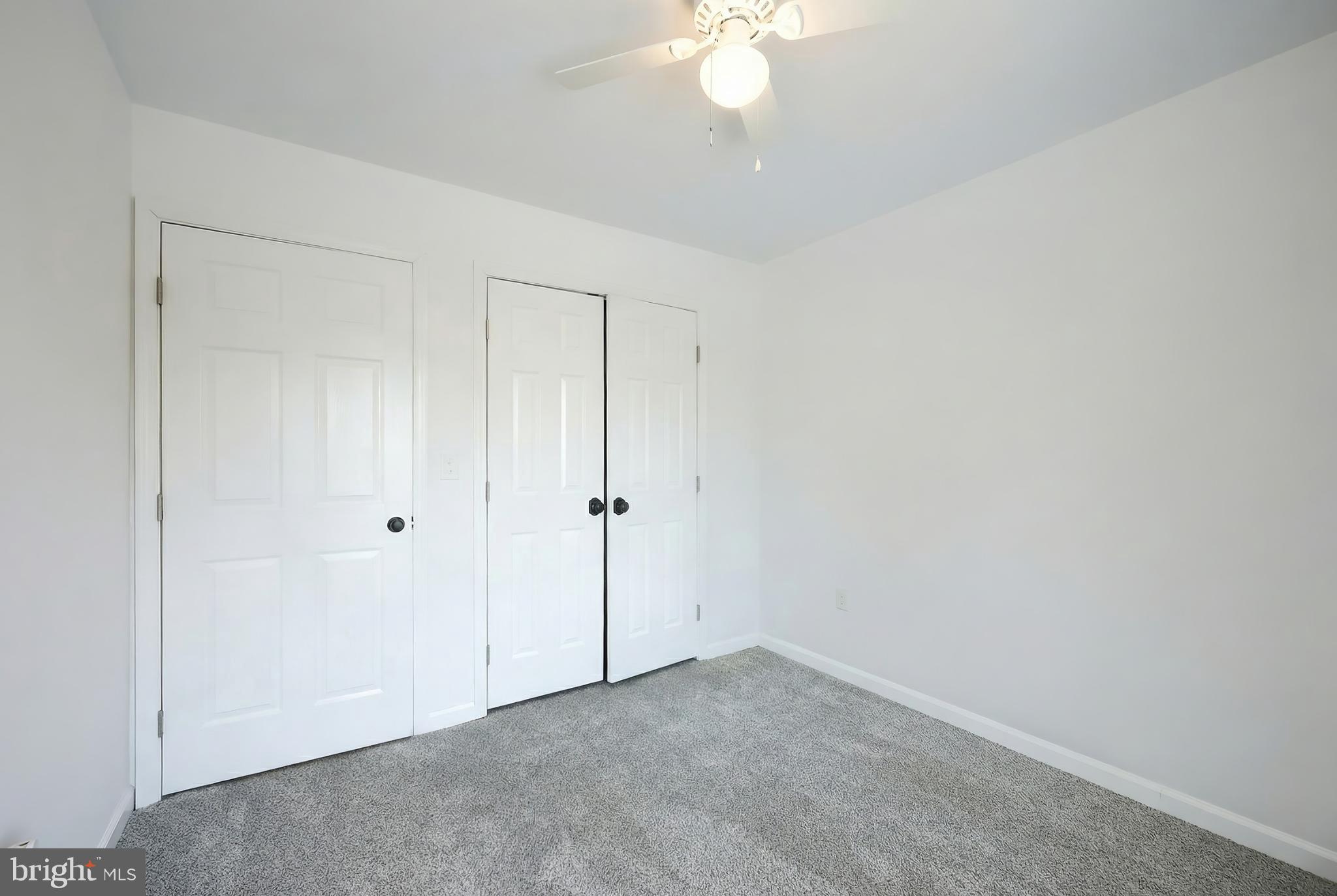 1885 Stoverstown Road, Unit 9 Spring Grove, PA 17362 - Photo 19 of 29 a view of an empty room with a chandelier fan