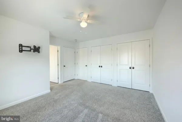 a bathroom with a sink vanity and a mirror