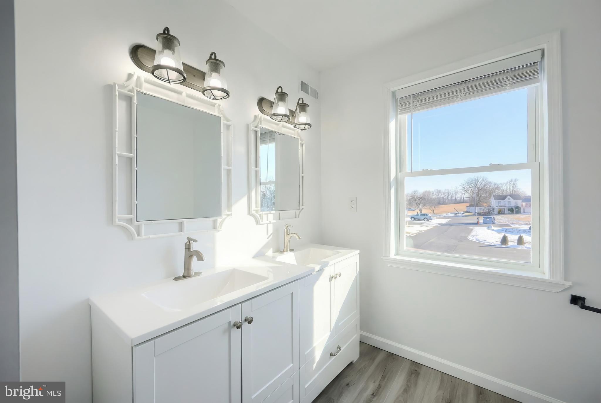 1885 Stoverstown Road, Unit 9 Spring Grove, PA 17362 - Photo 27 of 29 a bathroom with a sink vanity and a mirror