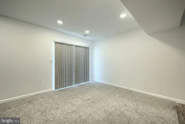 an empty room with closet area
