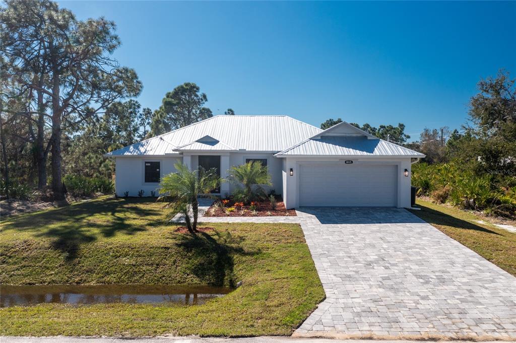 4035 Amari Road North Port, FL 34291 - Photo 1 of 1 Beautiful Paver Stone Driveway And Metal Roof Come Standard Menso Homes.