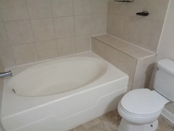 a close view of a bathtub in bathroom