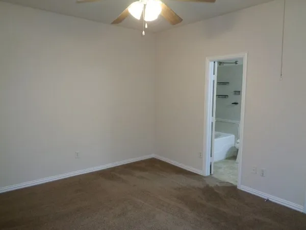 an empty room with a bathroom