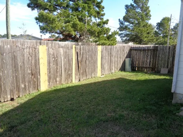 a view of a yard with a small cabin