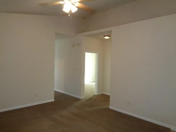 a view of an empty room and window in a room
