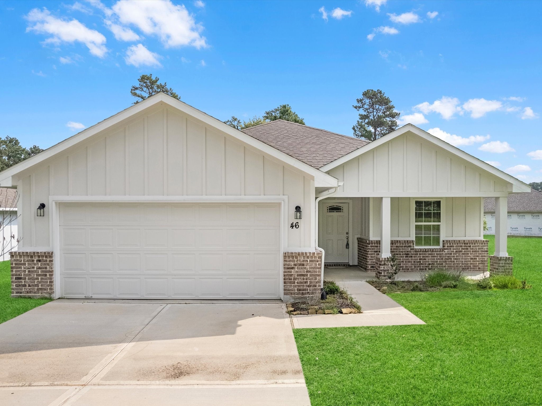 46 Fairway Drive Trinity, TX 75862 - Photo 1 of 26 a front view of a house with a yard and garage