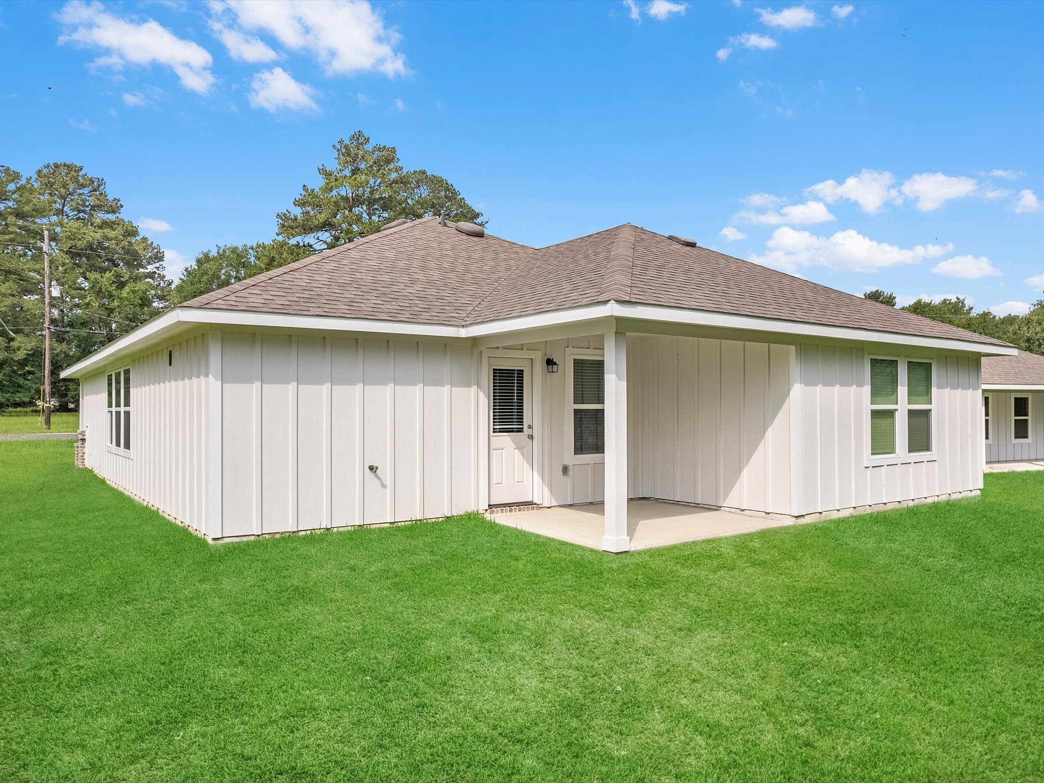 46 Fairway Drive Trinity, TX 75862 - Photo 20 of 26 a front view of a house with a yard and porch