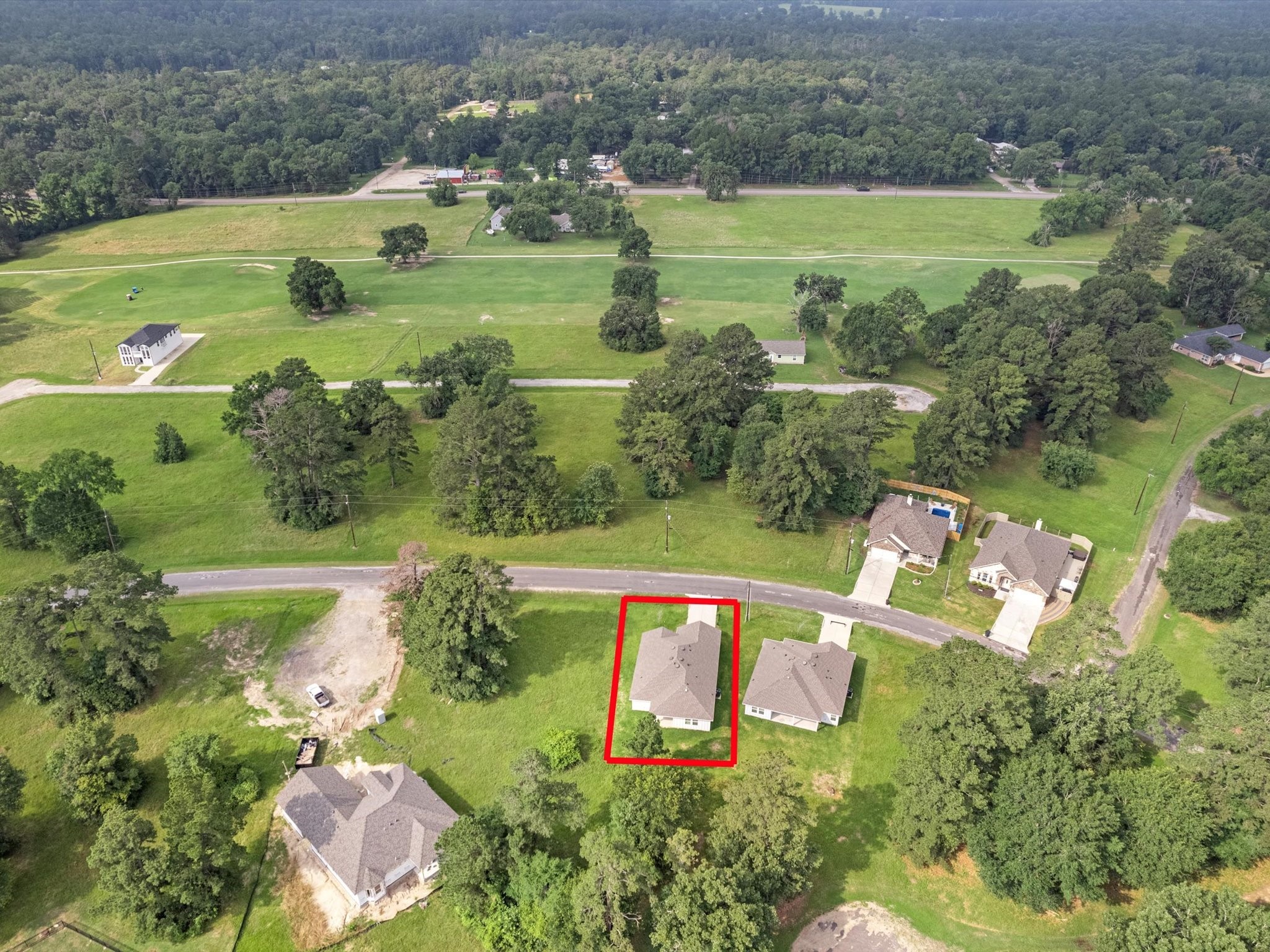 46 Fairway Drive Trinity, TX 75862 - Photo 25 of 26 an aerial view of a houses with outdoor space and a lake view
