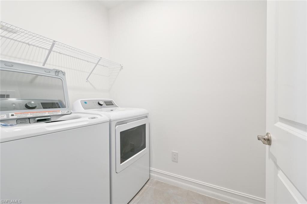 7611 Morgan Way Naples, FL 34119 - Photo 18 of 26 a utility room with dryer and washer