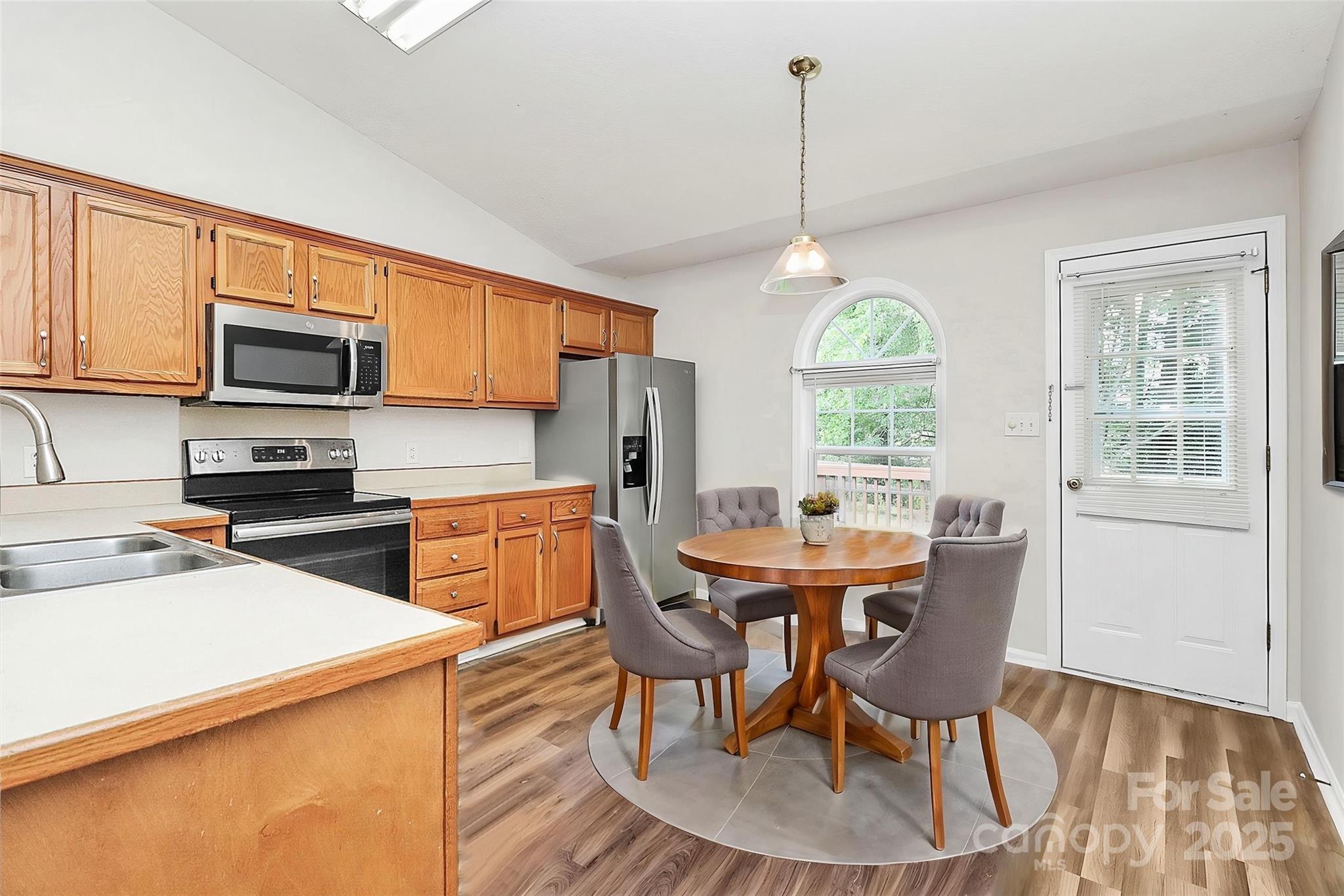 5114 Daffodil Lane Concord, NC 28025 - Photo 6 of 30 a view of a dining room with furniture window and outside view