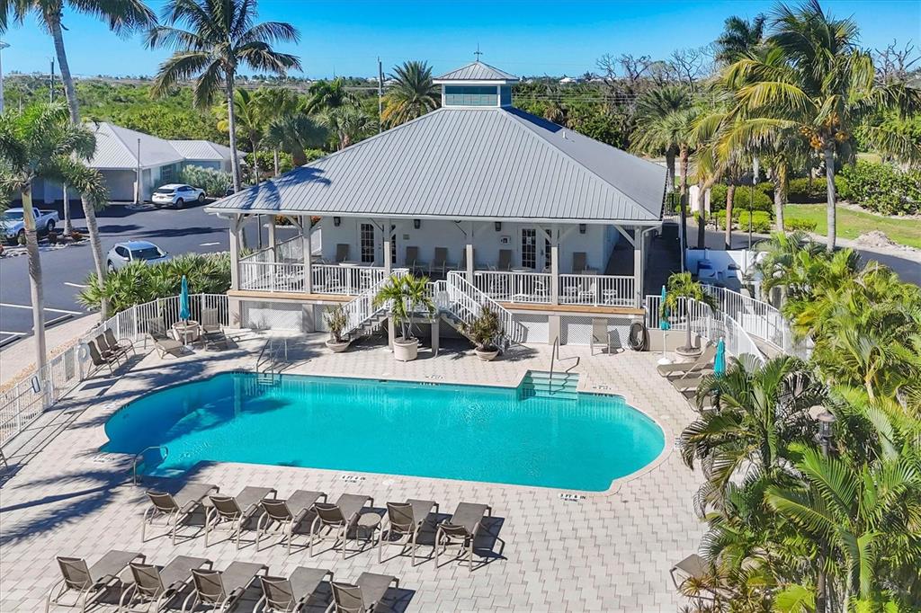 13113 Gasparilla Road, Unit 403 Placida, FL 33946 - Photo 47 of 62 a view of a house with swimming pool and sitting area