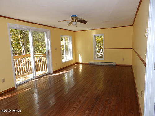 105 Roundhill Road Dingmans Ferry, PA 18328 - Photo 6 of 18 a view of an entryway with wooden floor