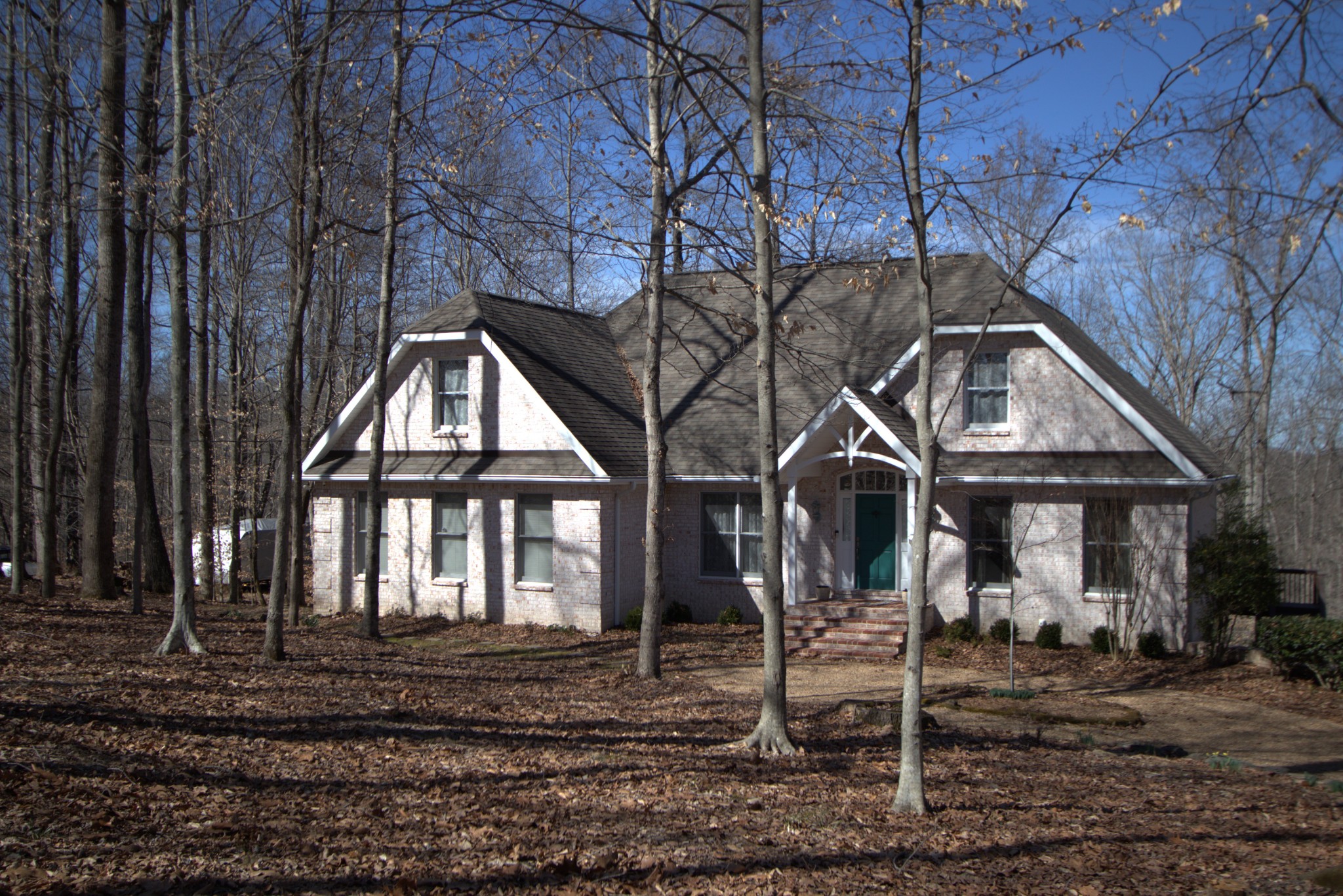 1008 Ridgecrest Drive Kingston Springs, TN 37082 - Photo 3 of 4 a front view of a house with iron fence