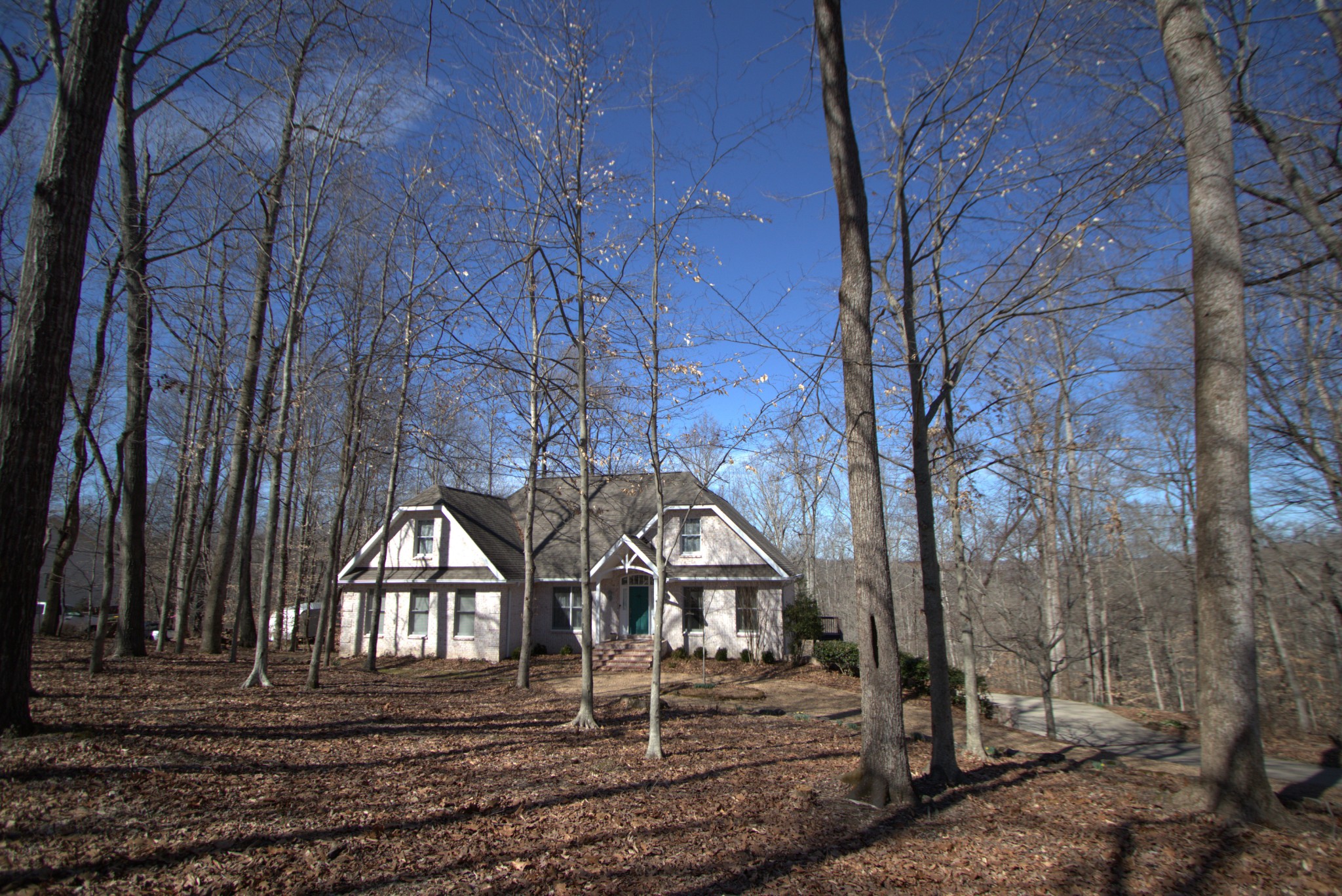 1008 Ridgecrest Drive Kingston Springs, TN 37082 - Photo 4 of 4 a front view of a house with large trees