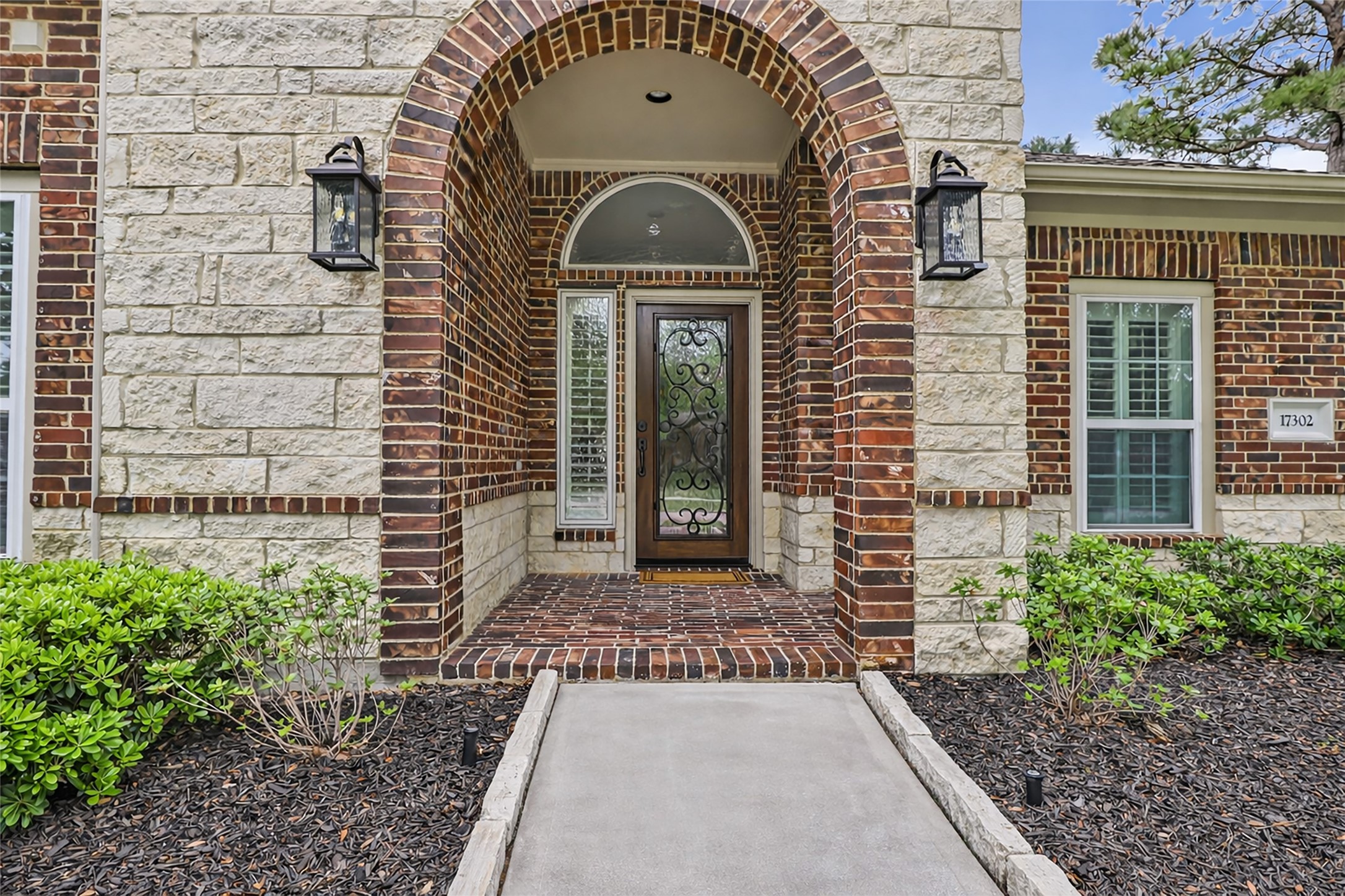 17302 Pipestone Point Court Humble, TX 77346 - Photo 2 of 50 Stone and brick archways welcome you home.