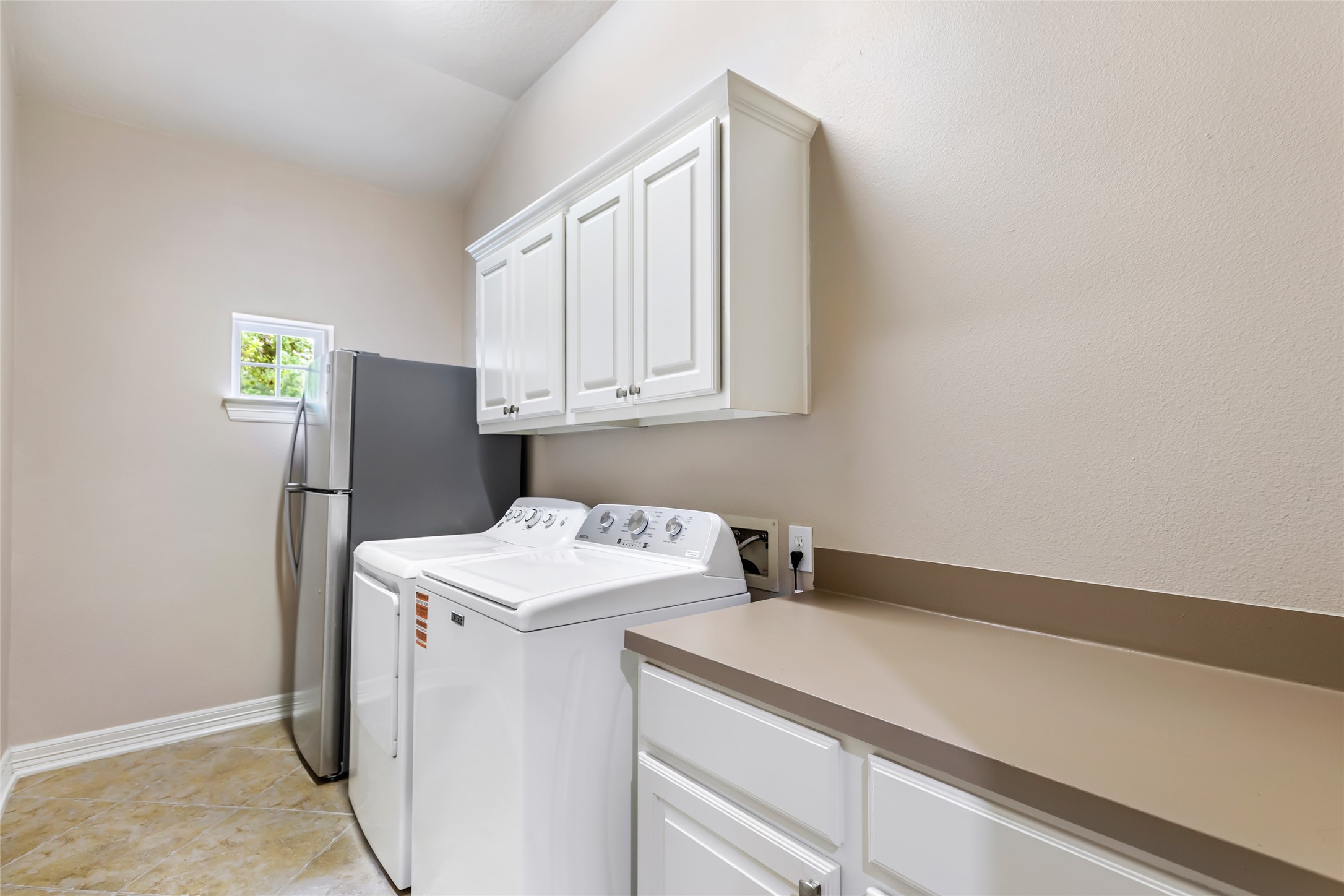 17302 Pipestone Point Court Humble, TX 77346 - Photo 27 of 50 Functional utility room with more storage and countertop for folding