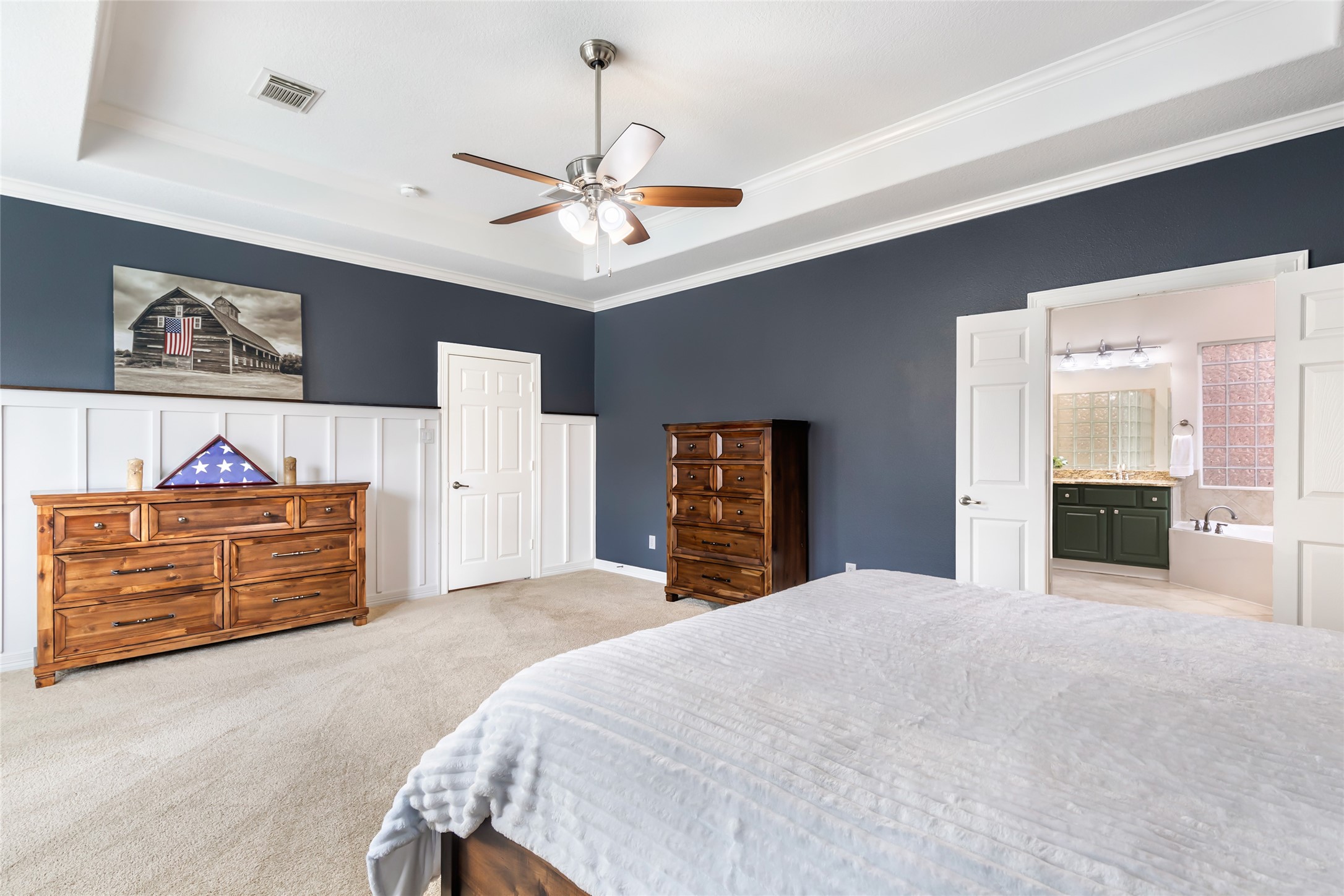 17302 Pipestone Point Court Humble, TX 77346 - Photo 29 of 50 Luxurious primary suite with wainscoting wall