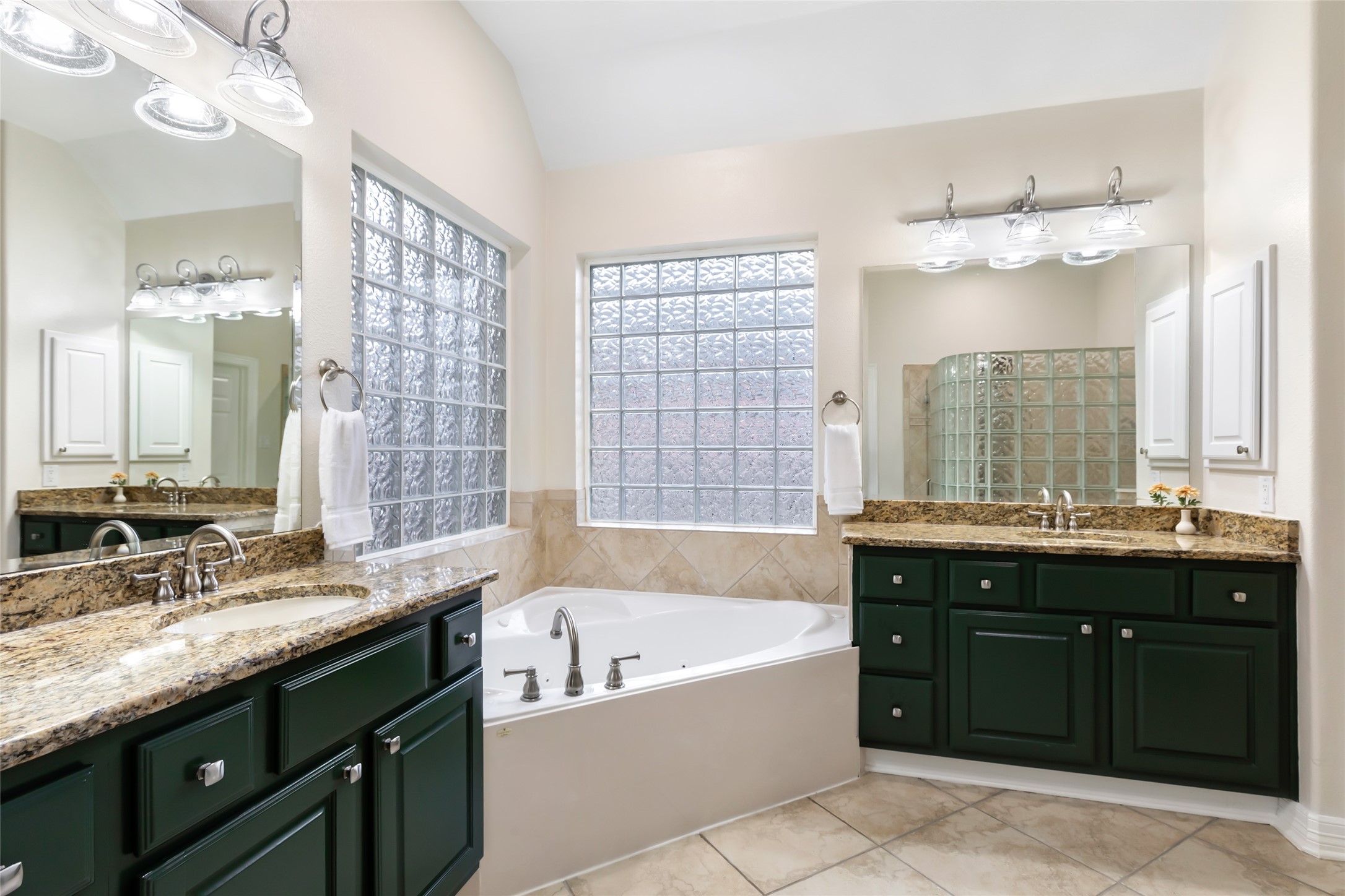 17302 Pipestone Point Court Humble, TX 77346 - Photo 31 of 50 Thoughful design of bathroom with dual vanities and large soaking tub