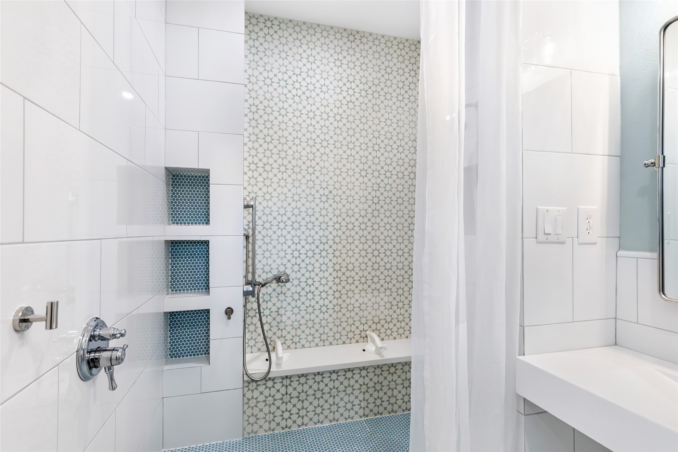 17302 Pipestone Point Court Humble, TX 77346 - Photo 38 of 50 Modern tile and decorative, patterned accent wall adorn the accessible shower.