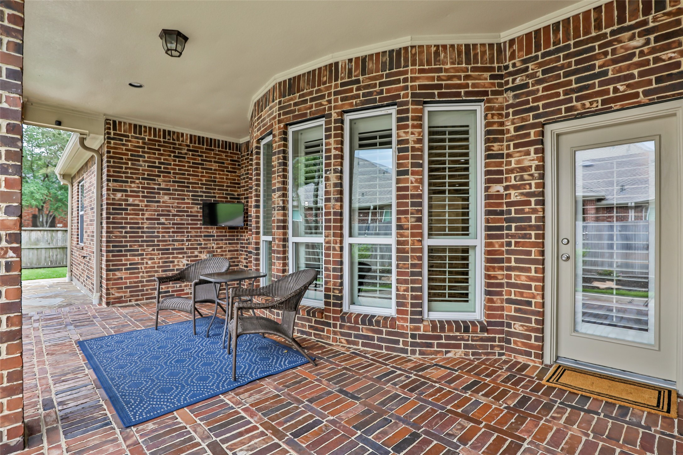 17302 Pipestone Point Court Humble, TX 77346 - Photo 44 of 50 Inviting patio with mounted TV off the living room
