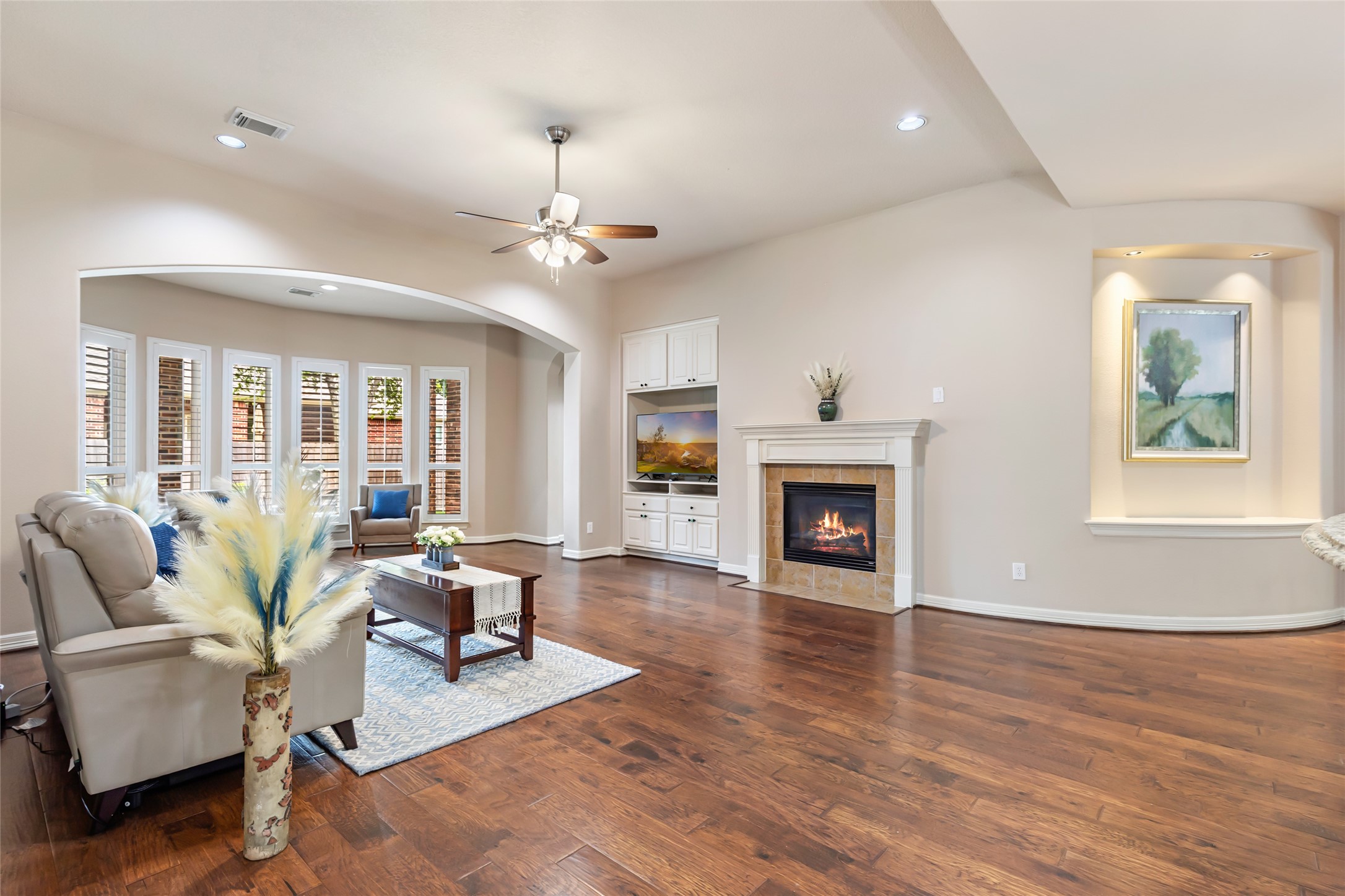 17302 Pipestone Point Court Humble, TX 77346 - Photo 5 of 50 Spacious living room with large windows connecting to the kitchen and dining room