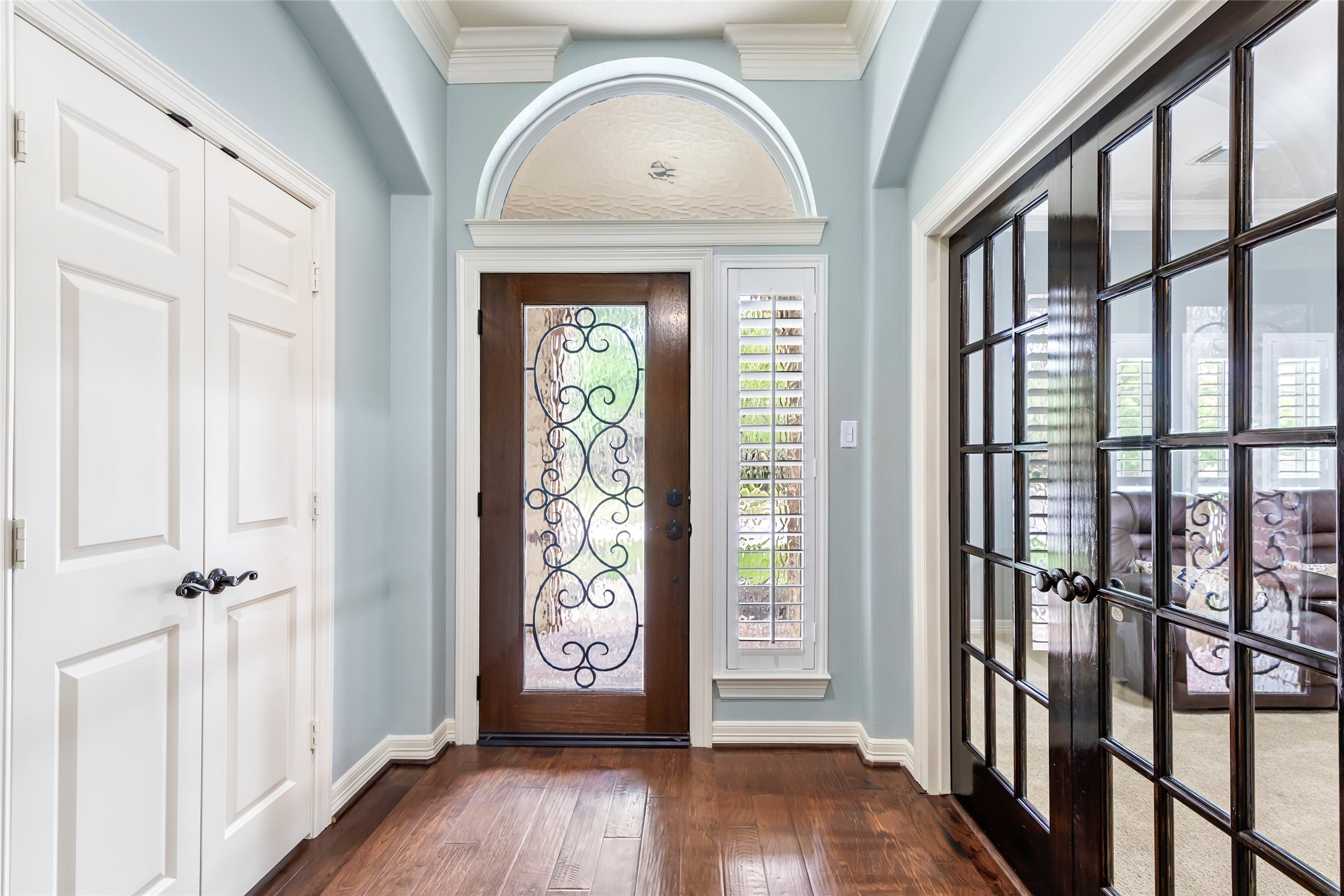 17302 Pipestone Point Court Humble, TX 77346 - Photo 6 of 50 Inviting entryway with crown molding, flanked by paneled double doors leading to the flex room on the right and and bedroom on the left