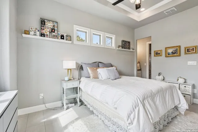 a bedroom with a bed and chair