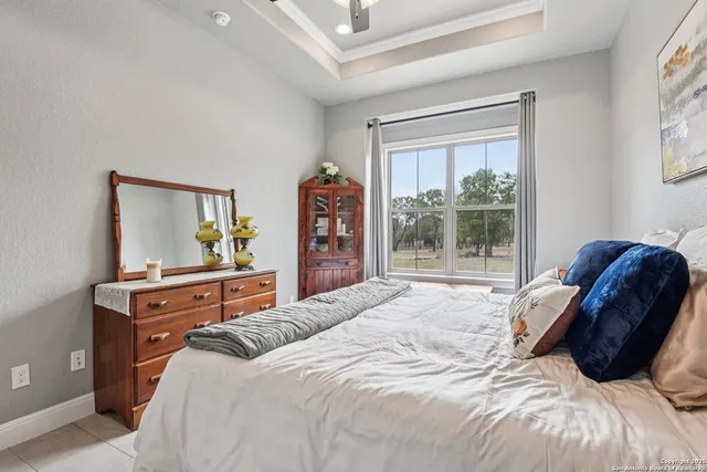 a living room with furniture and large windows