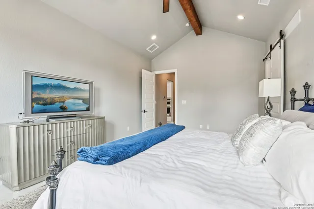 a white toilet sitting next to a shower curtain