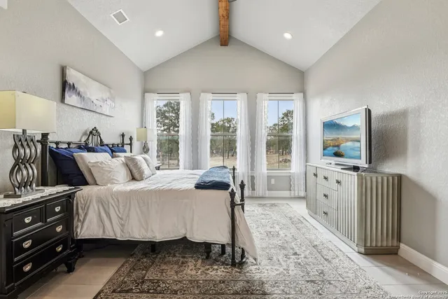 a bathroom with a granite countertop sink a shower and a mirror