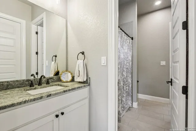 a bathroom with a sink a mirror and a toilet