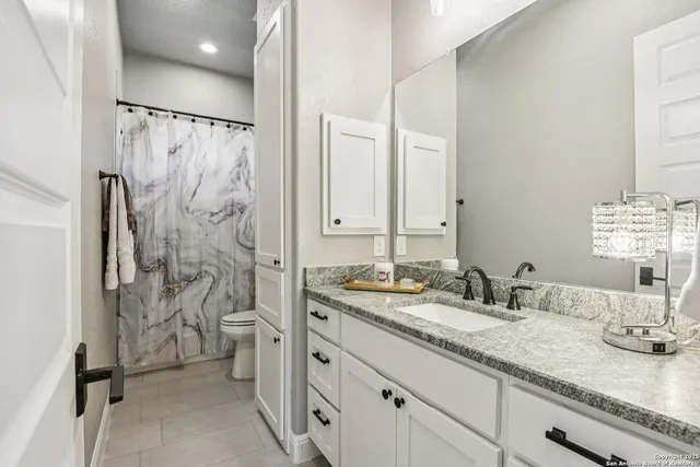 a kitchen with sink stove and cabinets