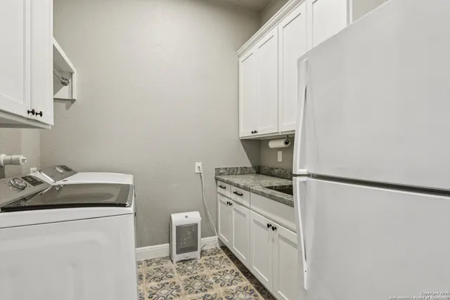 a white bath tub sitting in a bathroom