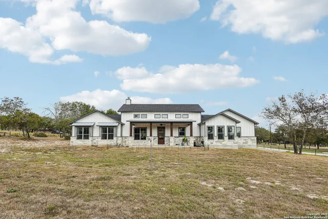 a swimming pool with trees in the background