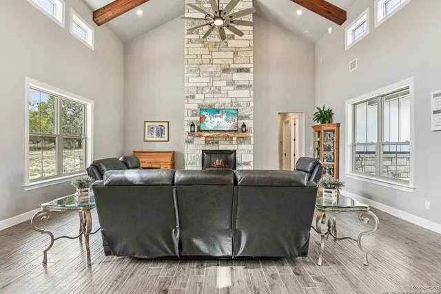 a living room with furniture and a fireplace